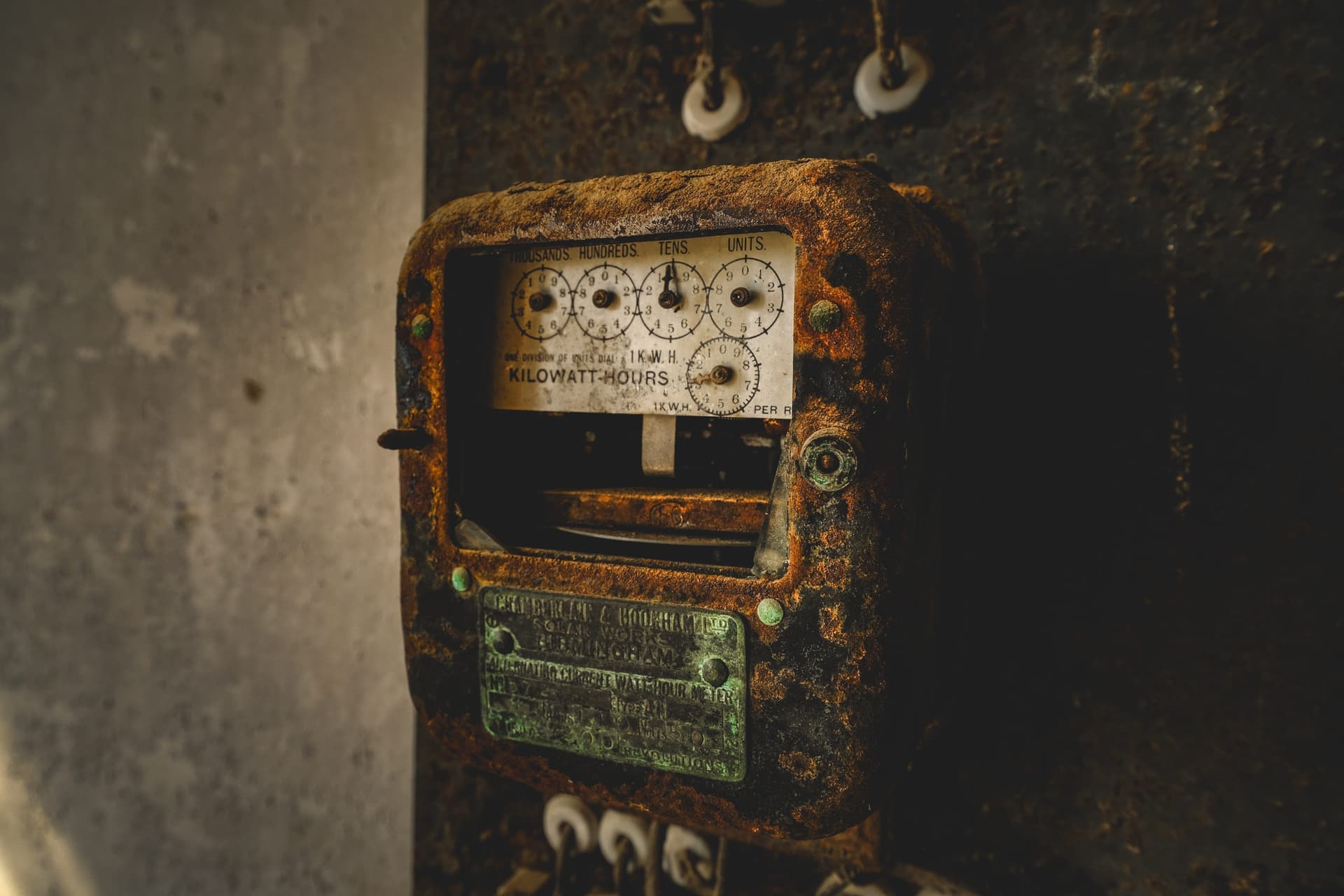 The dial face of a domestic electricity meter, close up.